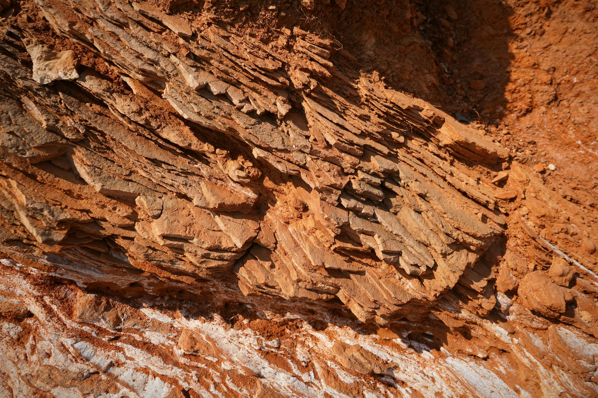 Close-up of natural rock formation showcasing rough texture and layers.